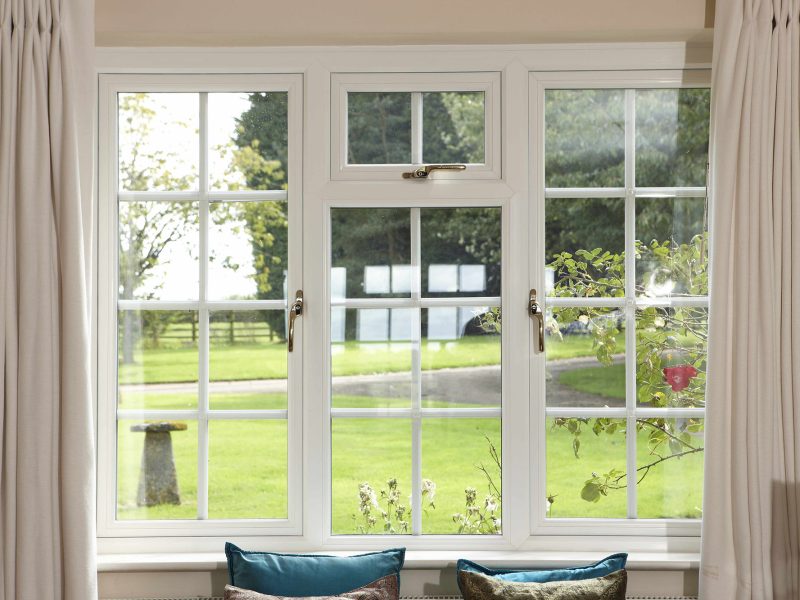 white upvc casement windows with gold window handles - Exclusive Glazing